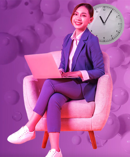 woman sitting with a laptop smiling