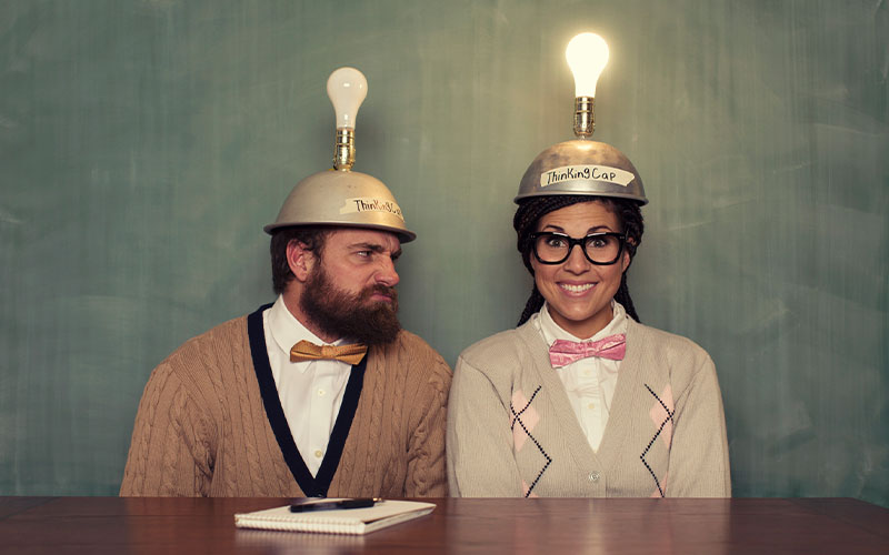 Two people with lightbulb hats