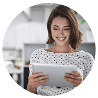 Casual smiling businesswoman on tablet