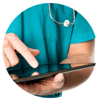 Healthcare nurse using tablet computer to review patients secure information