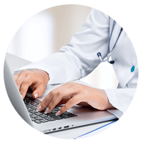 Doctor typing on laptop computer