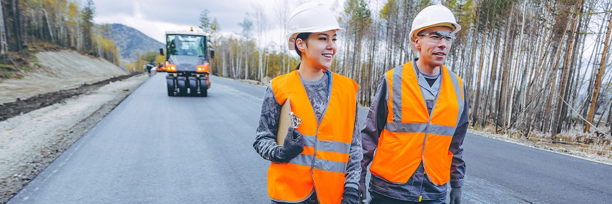 workers wearing oranges vests