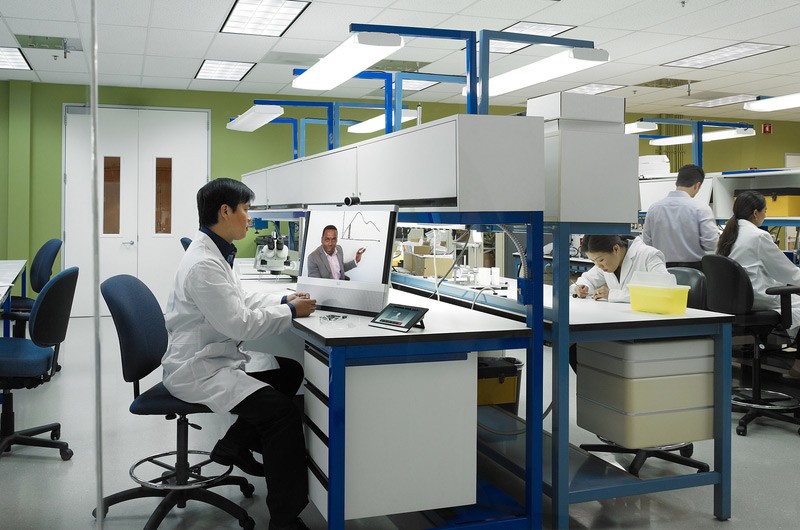 Lab interior with technician video conferencting.