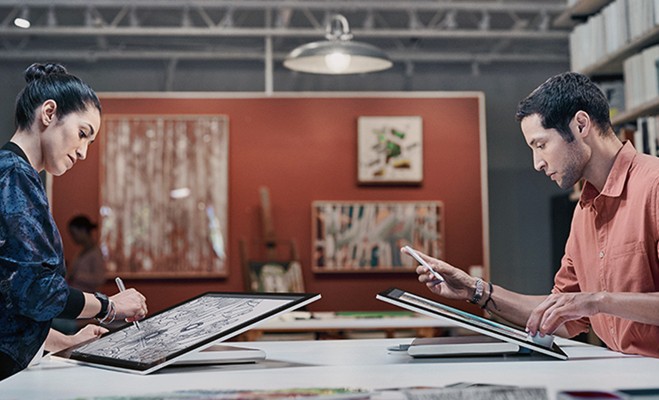 Microsoft Surface Studio all-in-one-workstation being used by designers at design agency.