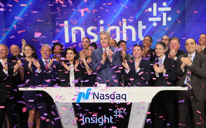 Insight at NASDAQ, confetti falling from ceiling, employees smiling and clapping