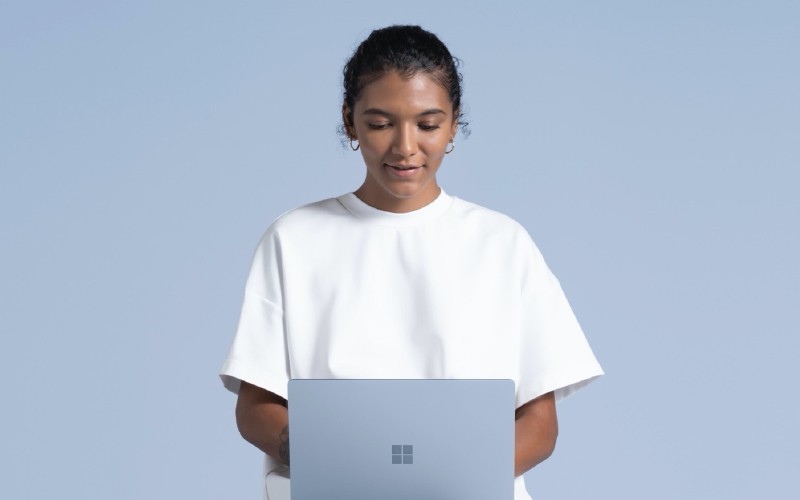 Woman working on Surface Laptop 4