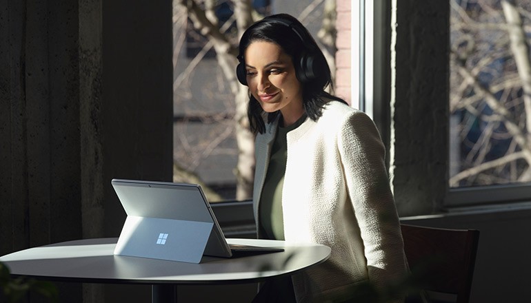 Woman using Microsoft Surface device