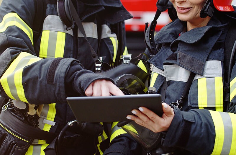 Firefighters using tablet device