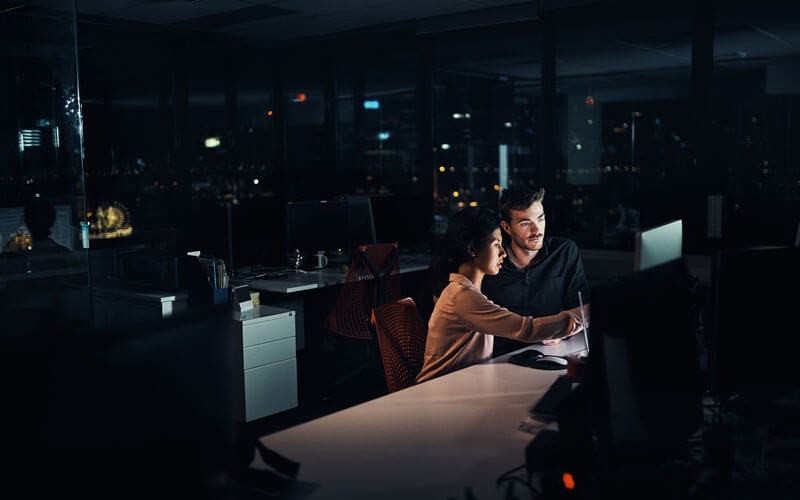 Two users working at night