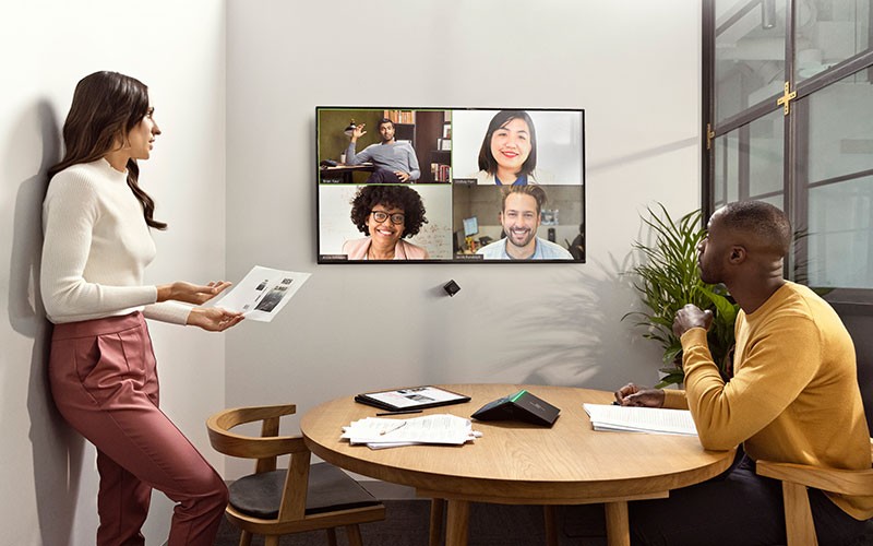 Users collaborating in conference room virtually with HP Presence products