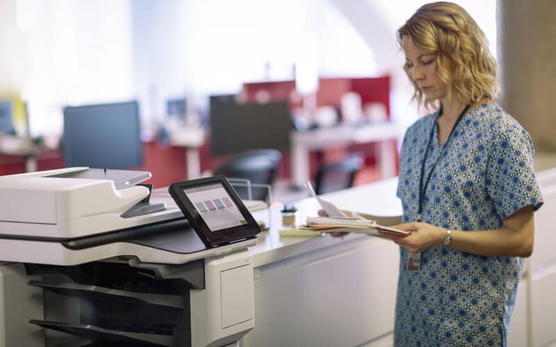 HP healthcare nurse using HP printer