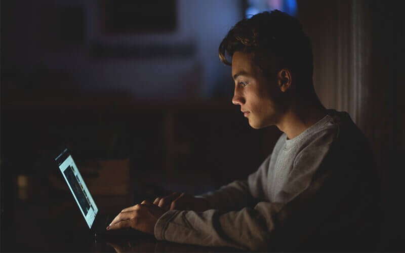 Man working using a laptop at the home