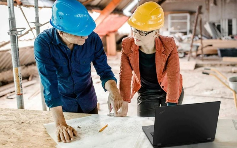 Two users working in construction site with ThinkPad P16s
